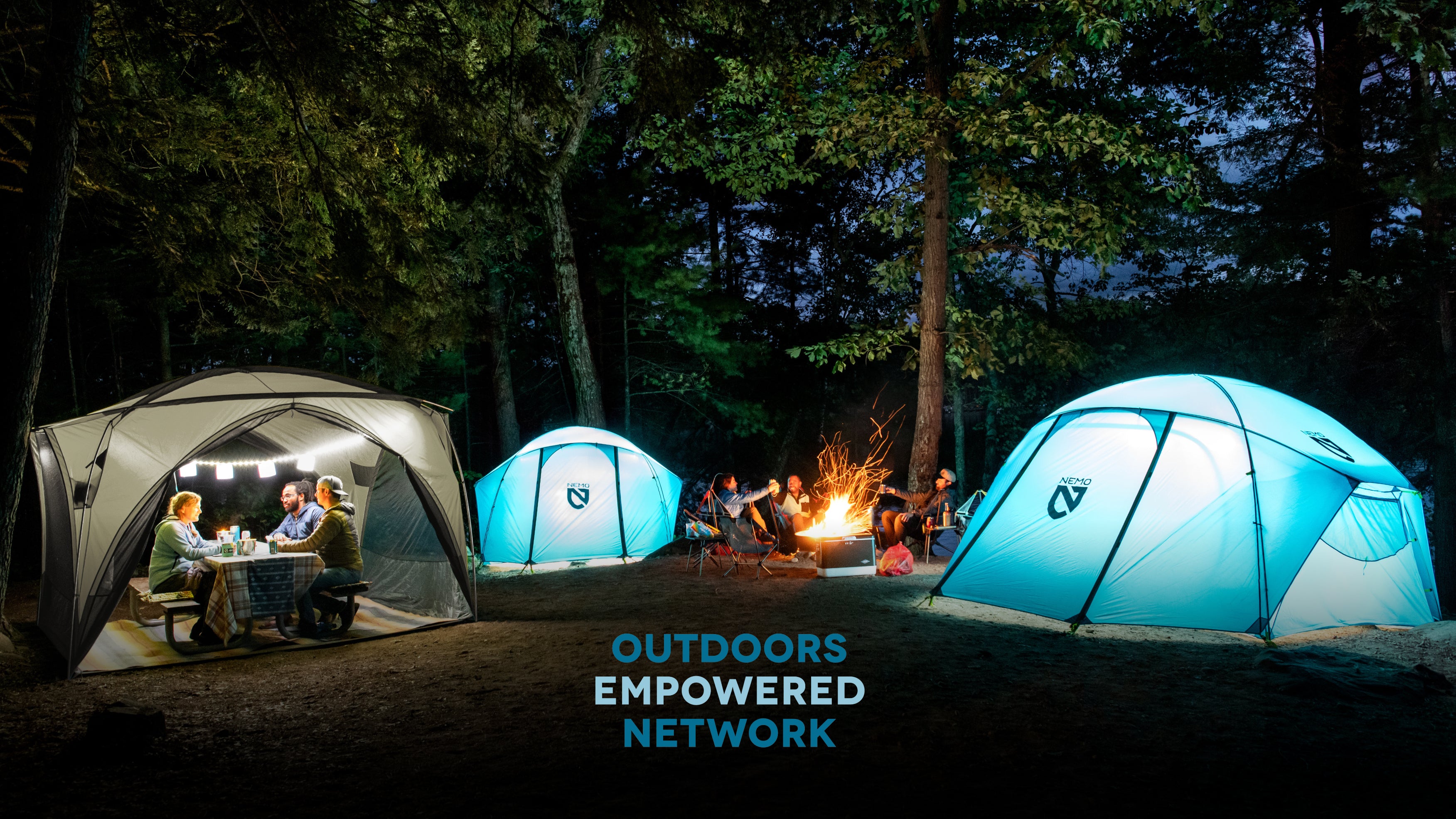 NEMO tents around a campfire